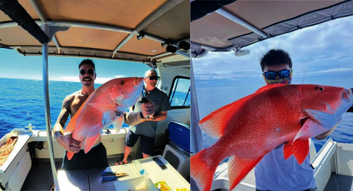 Anglers holding freshly caught fish