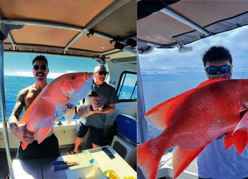 Anglers holding freshly caught fish