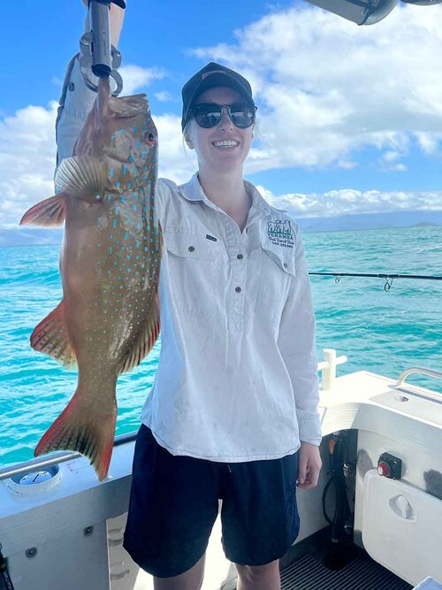 Angler holding Coral trout