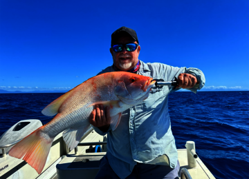 Angler holding a freshly caught fish