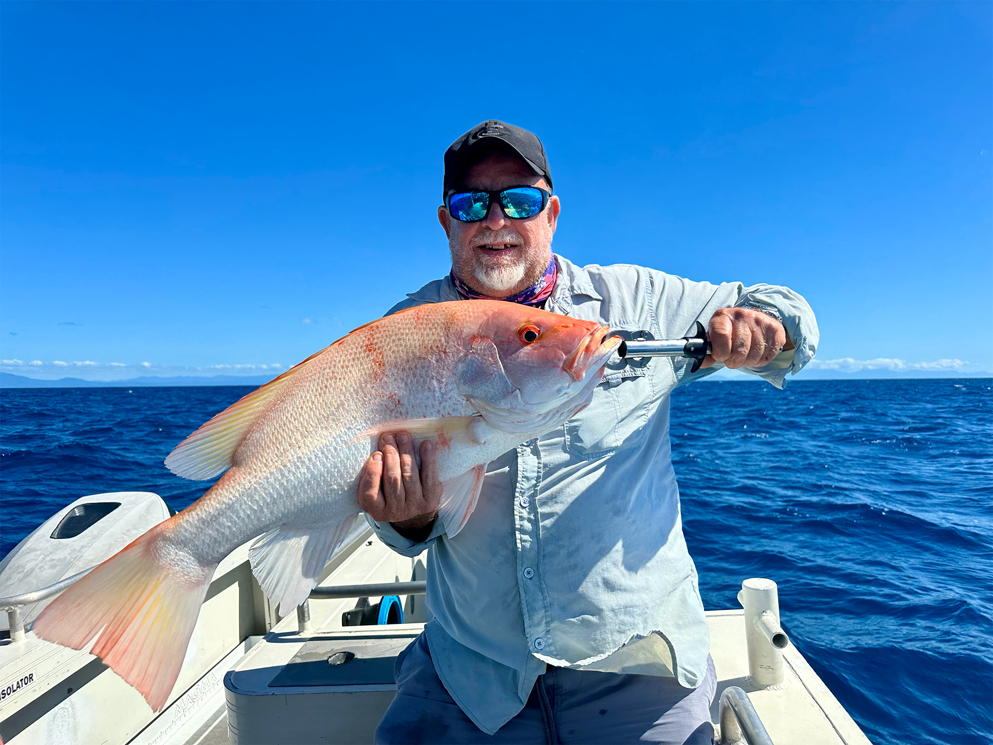 Angler holding a freshly caught fish